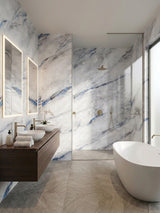 Modern bathroom with blue-veined 3D Bluewave PVC marble sheets on the vanity, shower, and bathtub walls