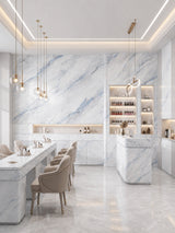 Bright dining and bar interior finished with blue-veined 3D Bluewave PVC marble sheets on walls and counters