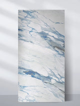 4 x 8 ft Calacatta Azur marble-look PVC wall panel with sweeping blue and gray veining on white