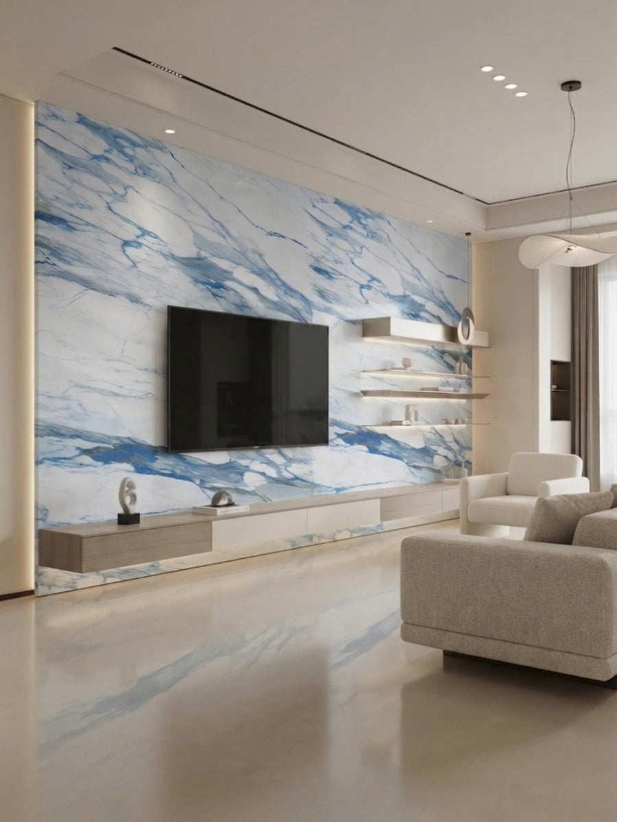Modern living room TV wall clad in white Calacatta Azur PVC panels with bold blue veining