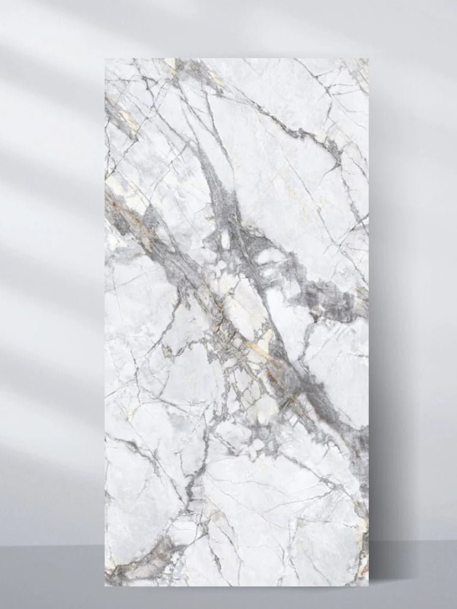 4x8 ft PVC marble sheet displayed upright with a white surface and dramatic gray and gold deep veining