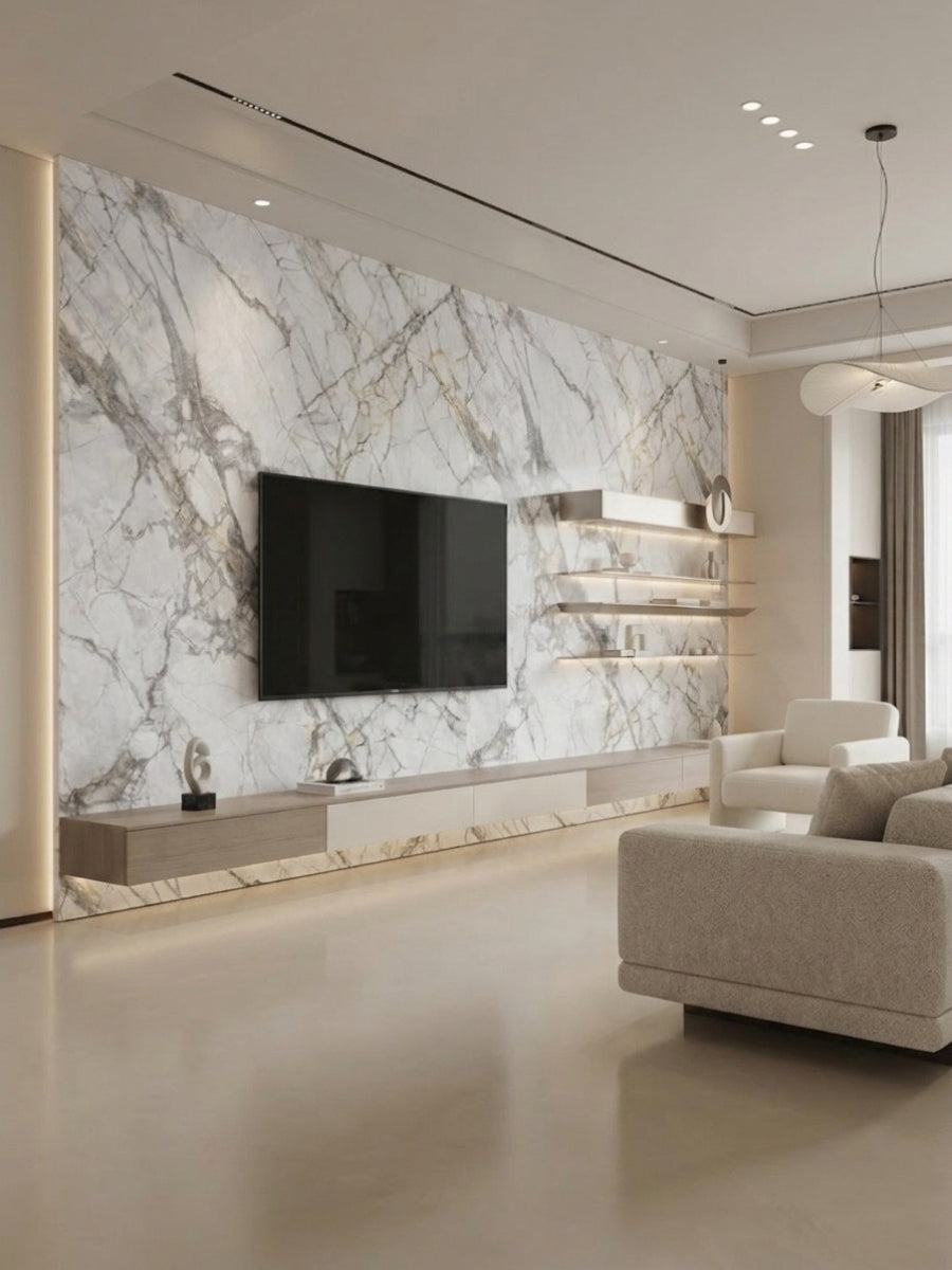 Deep-vein PVC marble sheets installed on a floor-to-ceiling TV feature wall with floating shelves