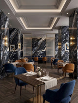 Restaurant interior with black Doral Night marble-look panels covering columns and accent walls