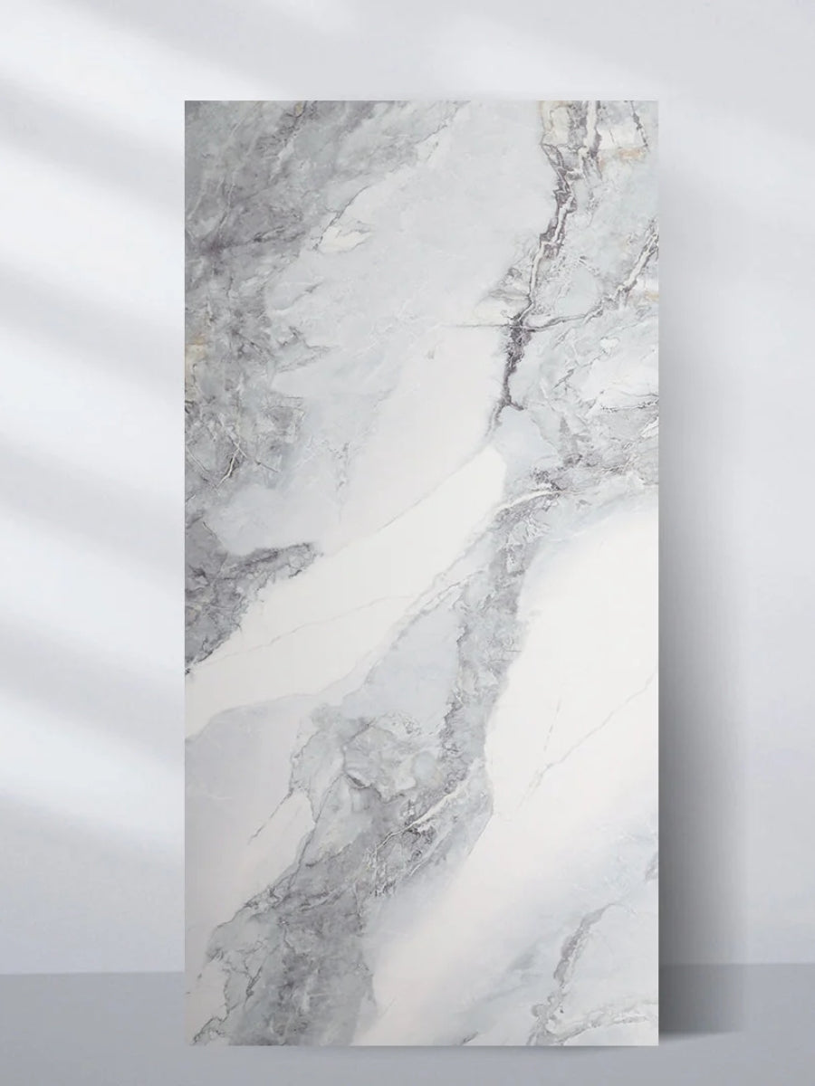 Upright 4 x 8 ft Frosted Sky PVC wall panel with a white marble look and flowing gray veining