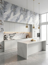 Modern white kitchen featuring Frosted Sky marble-look panels with bold gray veining on the walls and backsplash