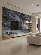 Modern living room media wall clad in Zena black marble PVC panels with dramatic gray and white veining