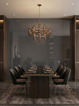 Gray mirror wood veneer panel reflecting a chandelier above a contemporary dining table