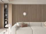 Fluted Royal Oak wall paneling behind a curved sofa in a neutral living room