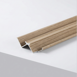 Close-up of wood-look aluminum inside corner trim for ash veneer wall panels