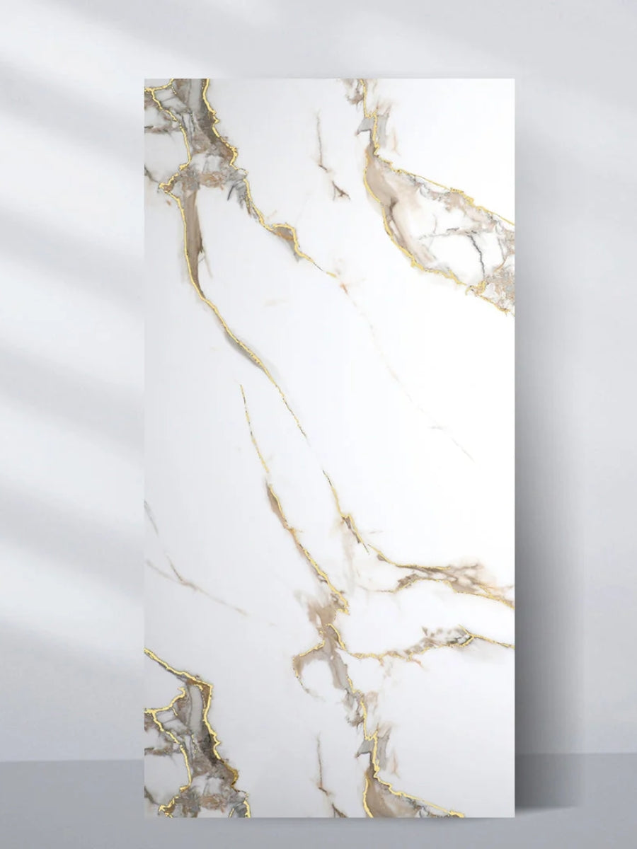 Calacatta Oro Gold 4 x 8 ft PVC wall panel with a white marble look and flowing gray and gold veining