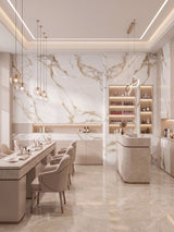 Contemporary nail salon with Calacatta Oro Gold marble-look PVC wall panels and matching counters