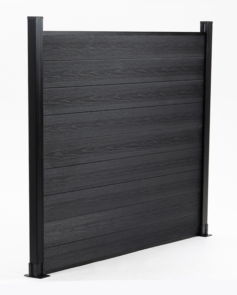 Black composite fence panel with posts, featuring co-extrusion technology for luxury outdoor fencing.