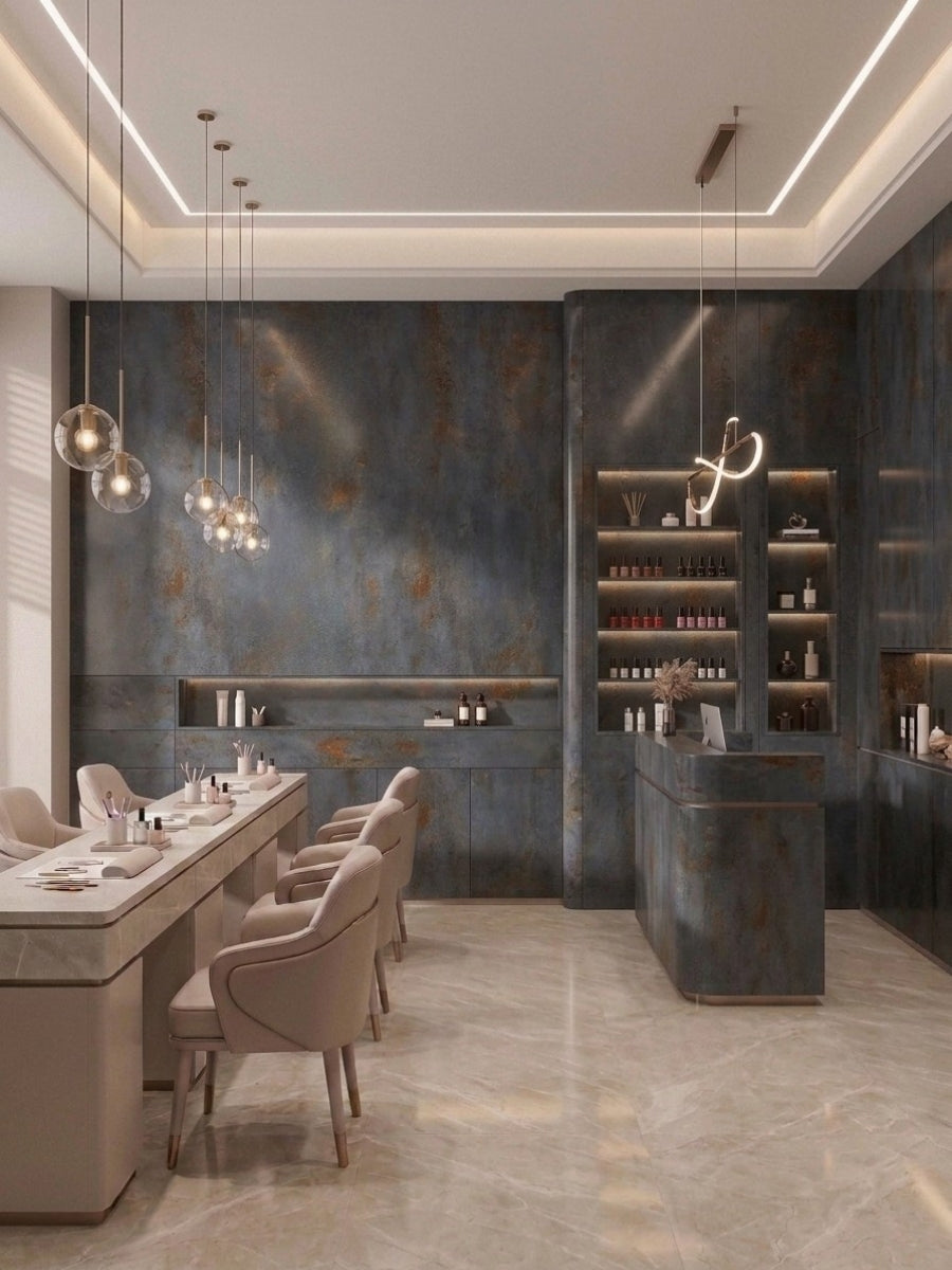 Dark charcoal stone panels installed across the walls and counter of a modern salon