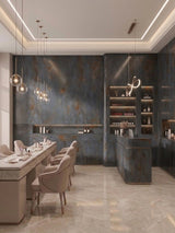 Dark charcoal stone panels installed across the walls and counter of a modern salon