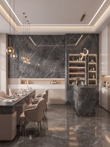 Dark gray marble PVC wall panels in a modern salon with manicure stations and a display cabinet