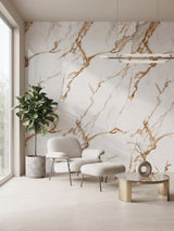 Sitting area with Ethereal Blush Marble wall panels featuring warm gold and taupe veining behind an armchair and ottoman