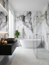 Modern bathroom with gray and brown veined marble-look PVC wall panels around a tub and shower