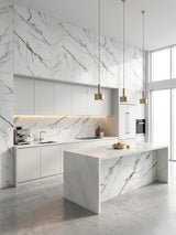 Bright modern kitchen with Moonlit Vein marble PVC wall panels above white cabinets and coordinating marble-look island