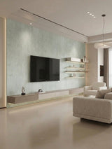 Pale green travertine-look PVC panels installed on a modern TV wall