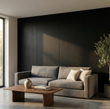 Blackwood veneer panels with visible vertical grain behind a gray sofa and wood coffee table