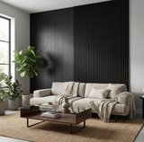 Blackwood veneer feature wall combining smooth panels and narrow vertical slats behind a cream sofa