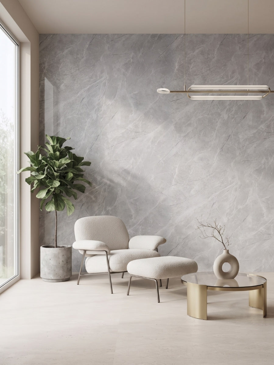 Gray Serene Stone Marble PVC wall panel behind a lounge chair, ottoman, and round table