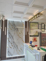 Stylish barber shop interior with glossy PVC marble walls