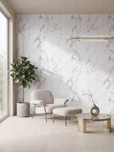White gray pearl marble-look PVC wall panels installed behind a lounge chair in a modern sitting area