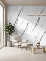 White matte marble PVC wall panels with gray veining installed behind a modern lounge chair