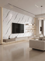 White marble-look PVC panels installed as a veined living room TV feature wall