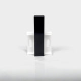 Black aluminum LED skirting baseboard channel, surface-mounted on white wall with brackets.