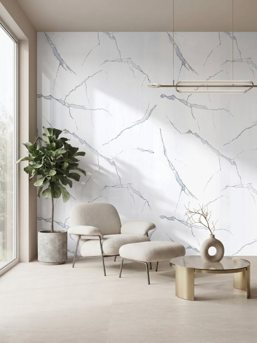 White Gray Pearl Marble PVC feature wall behind a cream lounge chair and potted tree