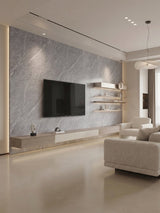 Modern living room with an ash gray marble-look PVC TV wall, floating console, shelves, and neutral seating