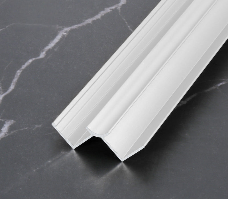 White 3mm aluminum inside corner trim profile on a dark marble surface